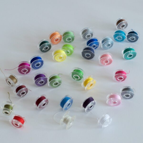 Sewing machine bobbins